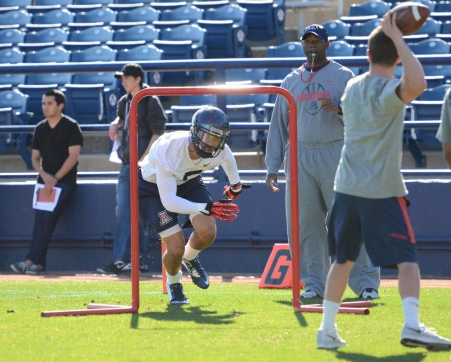 Arizona football wide receiver Trey Griffey (5) runs through drills  during Arizonas first spring practice on Wednesday at Kindall Field in  Frank Sancet Stadium. Griffey is part of a receiver corps that returns  many key players for spring practices.