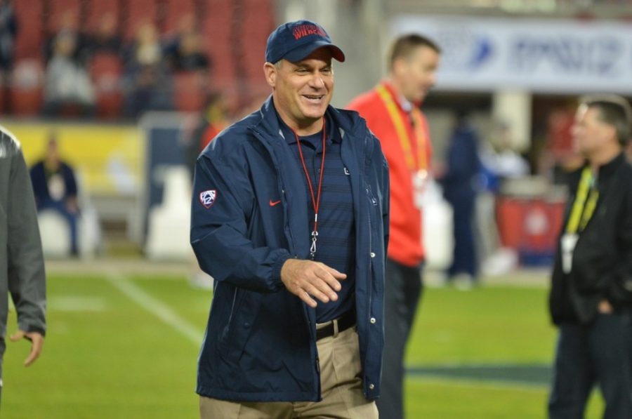 Arizona football coach Rich Rodriguez walks to greet someone off-field before Arizonas 51-13 loss to Oregon in the Pac-12 Championship Game in Levis Stadium in Santa Clara, Calif., on Dec. 5, 2014. Rodriguez and the Wildcats open spring practice today.