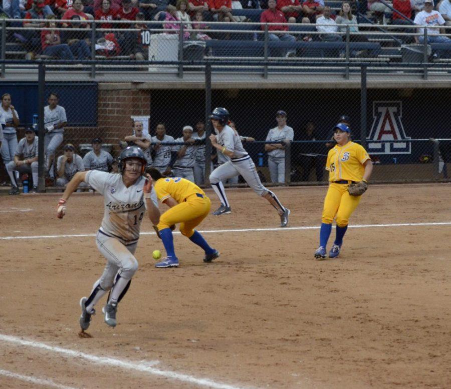 Arizona softball outfielder Eva Watson (14) runs down the first base line during Arizonas 9-1 victory over San Jose State on Feb. 14 at Hillenbrand Stadium. Watson is second on the team in stolen bases with six and has been a driving force behind the teams recommitment to speed this season.