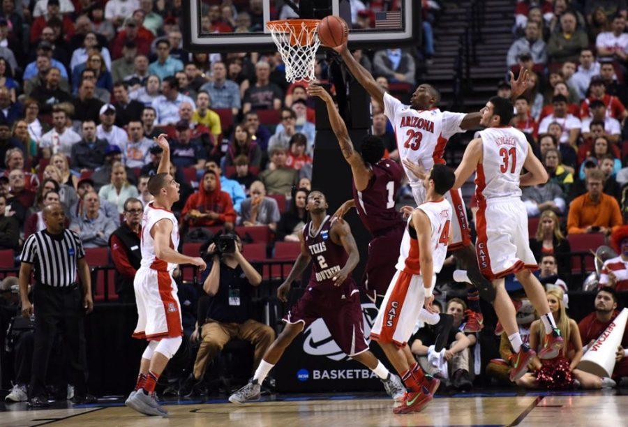 Arizona mens basketball forward Rondae Hollis-Jefferson (23) defends  Texas Southern guard Deverell Biggs (1) while T.J. McConnell (far left),  Elliot Pitts (24), and Matt Korcheck (31) look on during Arizonas  93-72 victory over Texas Southern during the round of 64 of the 2015  NCAA Tournament in the Moda Center in Portland, Ore., on Thursday.  Hollis-Jeffersons defensive versatility is a huge reason why Arizonas  defense has been so stingy this season.