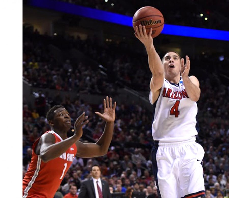 Arizona mens basketball guard T.J. McConnell (4) shoots a layup as Ohio State forward JaeSean Tate (1) looks on during Arizonas 73-58 victory in the Round of 32 in the 2015 NCAA Tournament against Ohio State in the Moda Center in Portland, Ore., on Saturday. McConnell and the Wildcats play Xavier in the Sweet Sixteen.