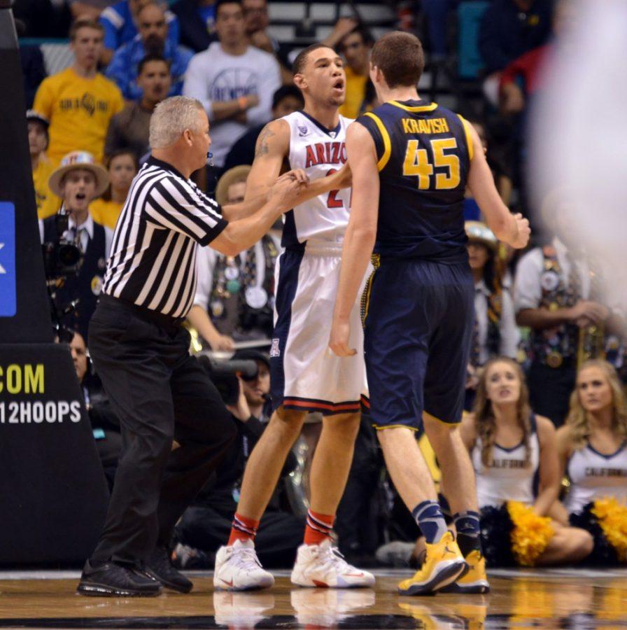 Arizona forward Brandon Ashley (21) gets into an altercation with California forward David Kravish (45) after Kravish sat on Ashley and pinned him to the ground during Arizonas 73-51 win against California in the MGM Grand Garden Arena in Las Vegas, Nev. on Thursday.