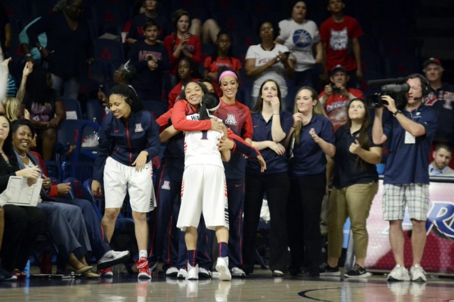 Arizona guard Candice Warthen (1) hugs coach Niya Butts as she walks off the court finishing her last regular season game of her senior year and Arizonas 64-41 win against Utah in McKale Center on Sunday. The Wildcats will face UCLA in the first round of the Pac-12 Conference womens basketball tournament on Thursday.