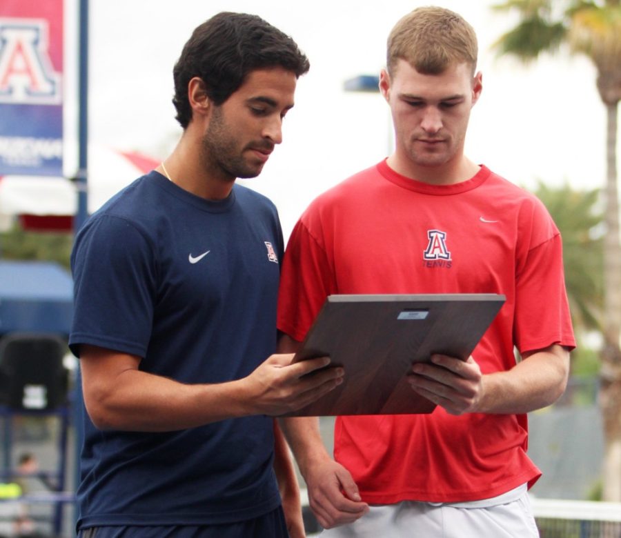 Arizona mens tennis player Sumeet Shinde receives a plaque during the senior day ceremony and Arizonas 4-1 loss to Washington at the LaNelle Robson Tennis Center on April 12. The Wildcats placed just one player in the NCAA tournament.