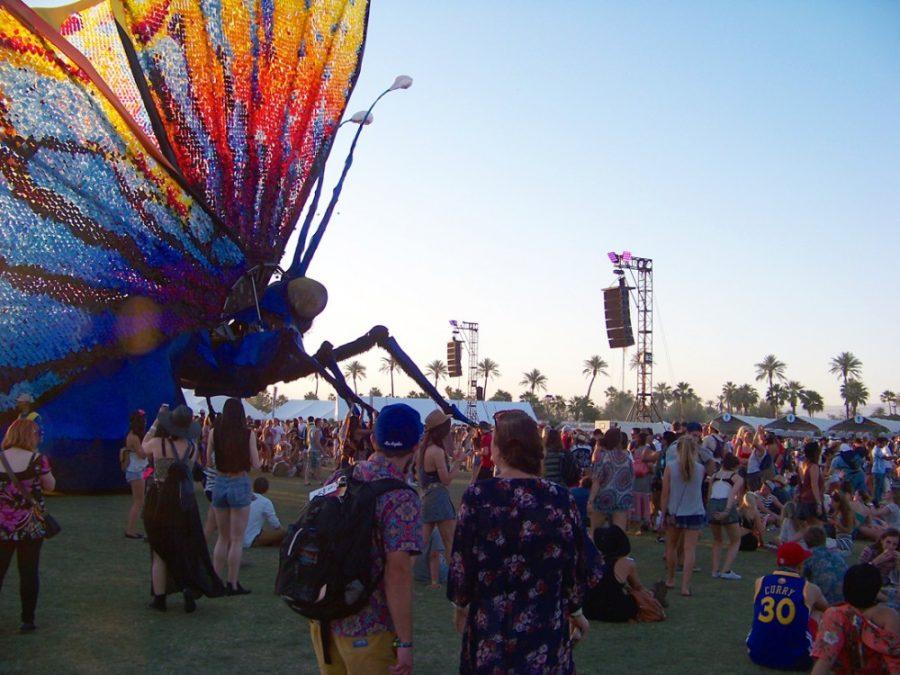 Attendees+of+Coachella+walk+around+the+giant+moving+butterfly+that+blossomed+from+a+caterpillar+on+Sunday.