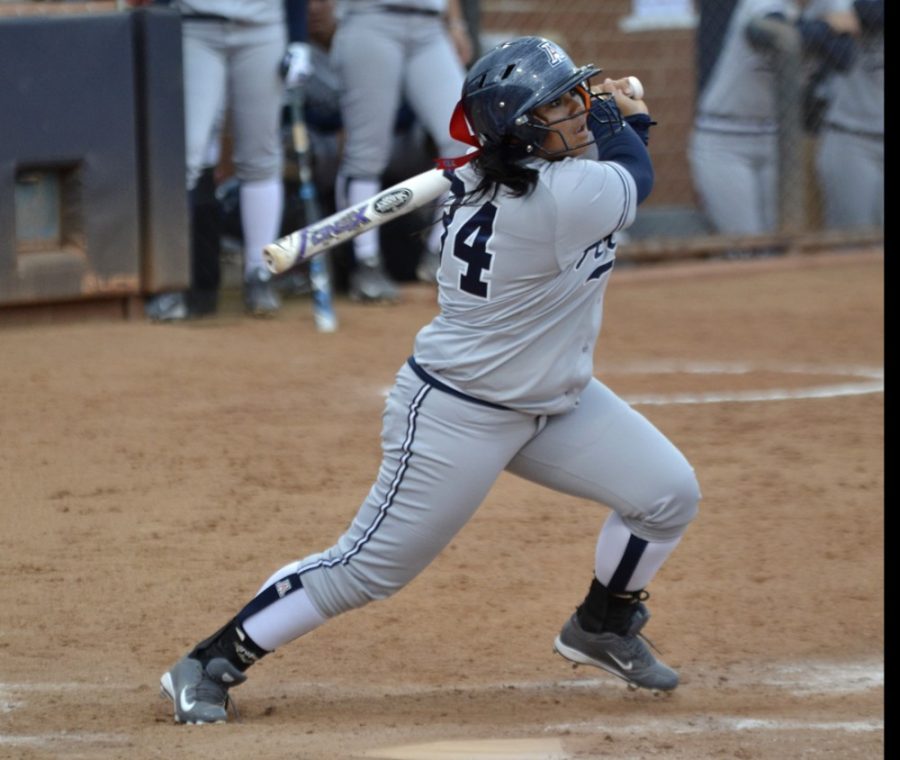 Arizona softball outfielder Katiyana Mauga (34) follows through on a swing during Arizonas 10-2 victory over UC Riverside on Saturday, Feb. 28, 2015 at Hillenbrand Stadium. Maugas power and poise have been driving forces behind Arizonas dominant offense.