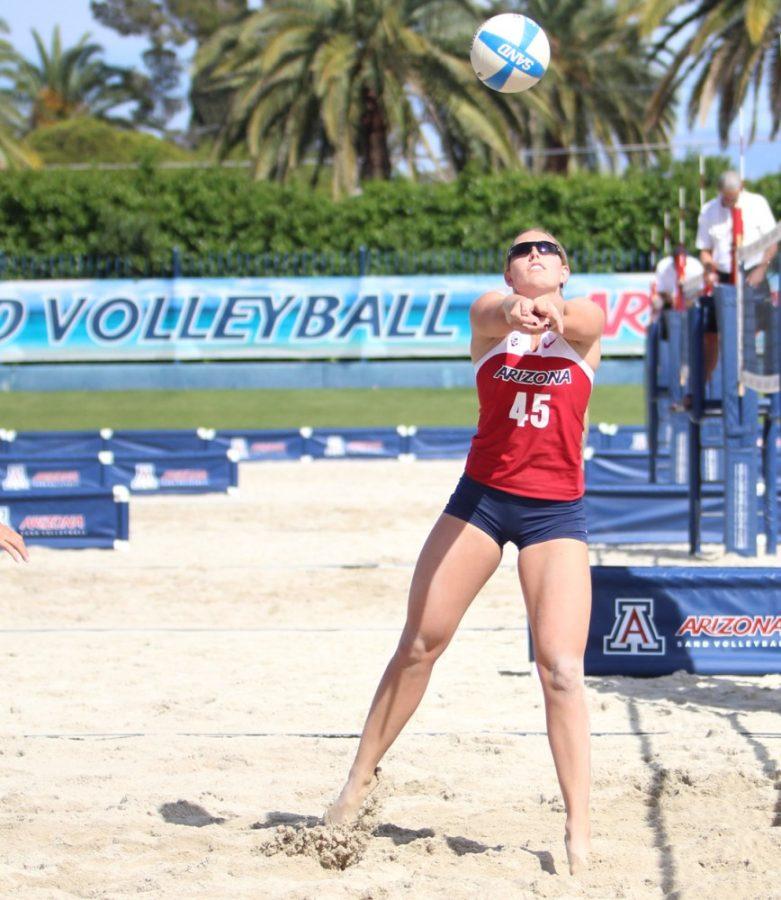 Arizona sand volleyball senior Madi Kingdon lobs the ball during Arizonas 5-0 victory over New Mexico on Saturday at Jimenez Field. Kingdon has emerged as a leader for sand volleyball after leading the indoor volleyball team for four seasons.
