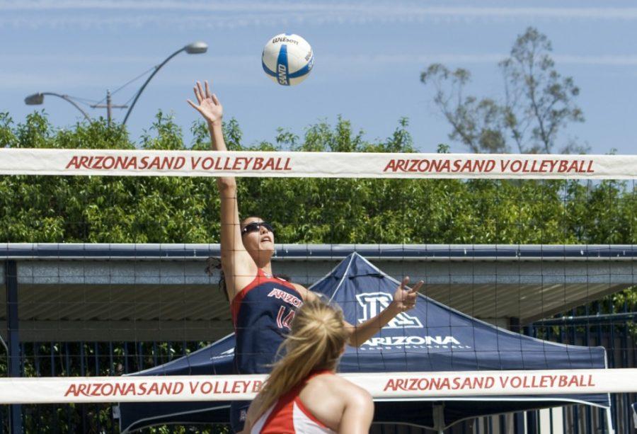 Arizona sand volleyball player Taylor Arizobal (14) jumps to make a spike during Arizonas 4-1 win against New Mexico on April 11. Arizobal and the Wildcats hit the road to participate in the Pac-12 Team and Pairs Invitational this weekend.