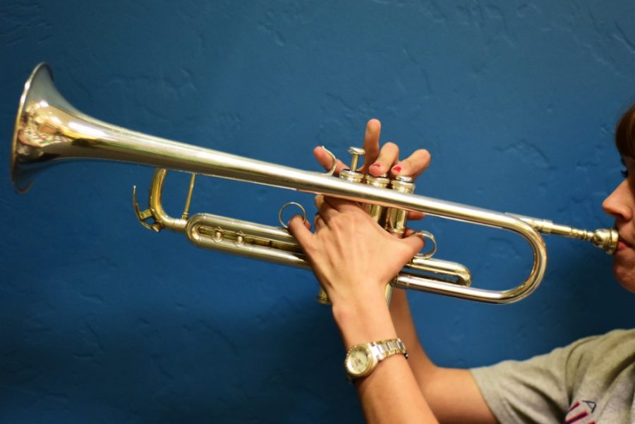 In dramatic pose, a trumpeter plays soulfully. Friday Night Live! Summer Concert Series sees UA student jazz musicians playing every other Friday.
