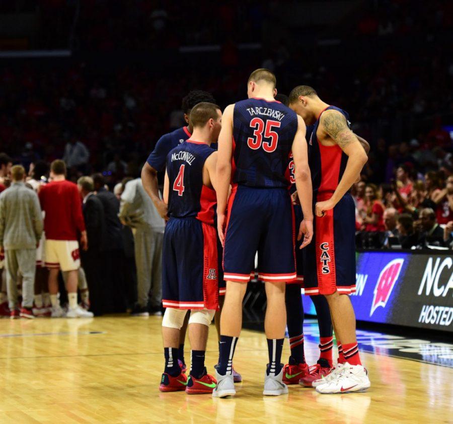 Arizona center Kaleb Tarczewski (35), center, and Arizona forward Brandon Ashley (21), right, huddle with teammates toward the end of a timeout during Arizonas 85-78 loss to Wisconsin at the Staples Center in Los Angeles on Saturday. Despite being five-star recruits, Tarczewski and Ashley have progressed as they maybe should have.