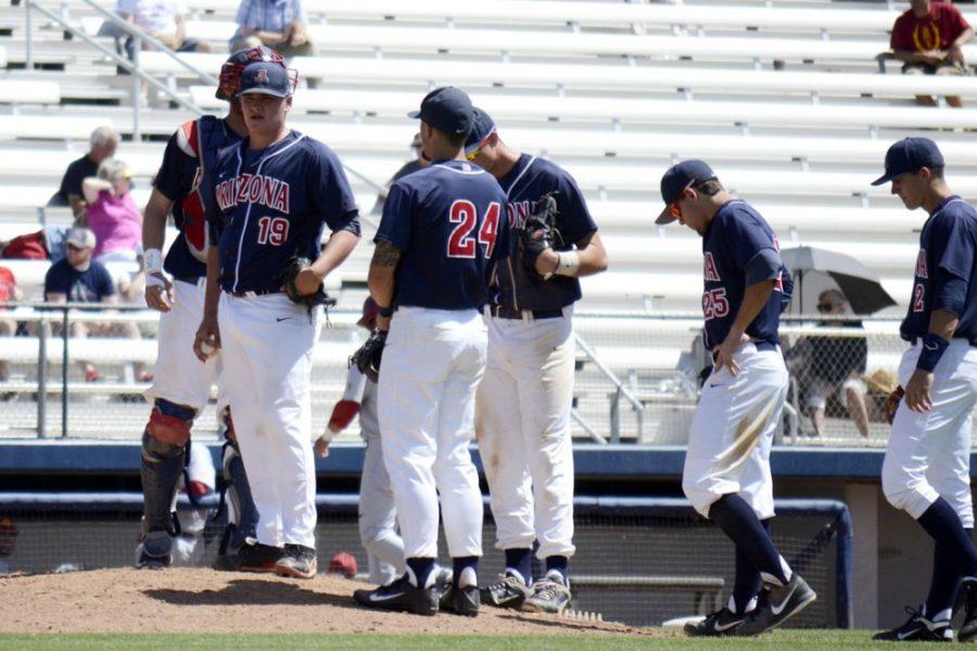 Arizona baseball pitcher Tyger Talley (19) and teammates stand around the pitchers mound during Arizonas 10-9 loss to USC at Hi Corbett Field on Saturday. Talley and the Wildcats were swept over a three-game series against USC.