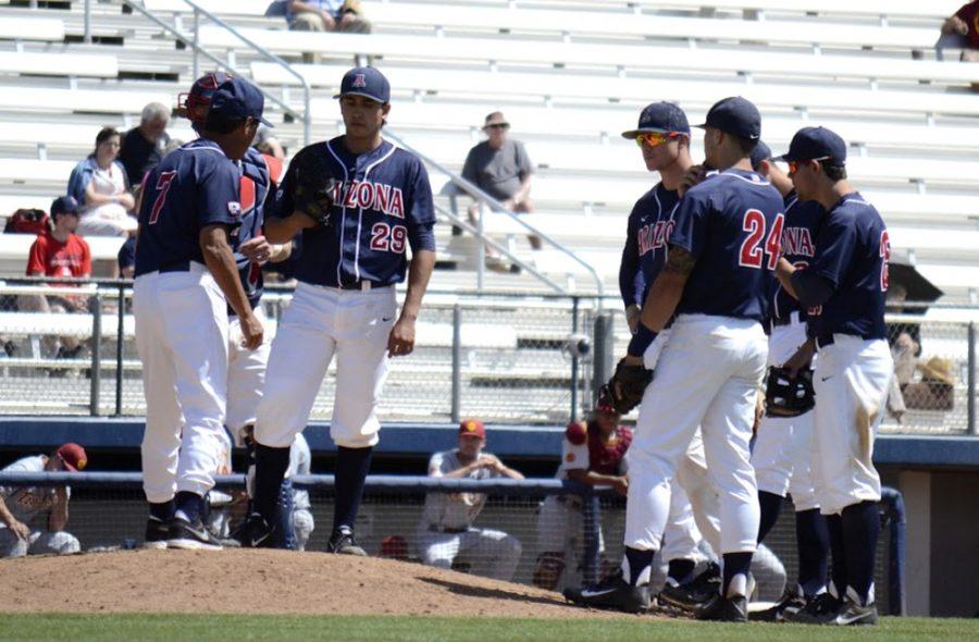Arizona baseball coach Andy Lopez (7) speaks to pitcher Rio Gomez (29) while others listen during Arizonas 10-9 loss against USC on April 4 at Hi Corbett Field. Fresh off three straight series lost, the Wildcats have dropped in the conference power rankings.