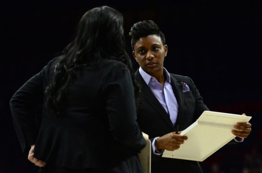 Arizona womens basketball coach Niya Butts consults with assistant coach and recruiting coordinator Calamity McEntire during Arizonas 65-46 loss to California in McKale Center on Feb. 6. Butts and the Wildcats capped their 2015 recruiting class at four players.