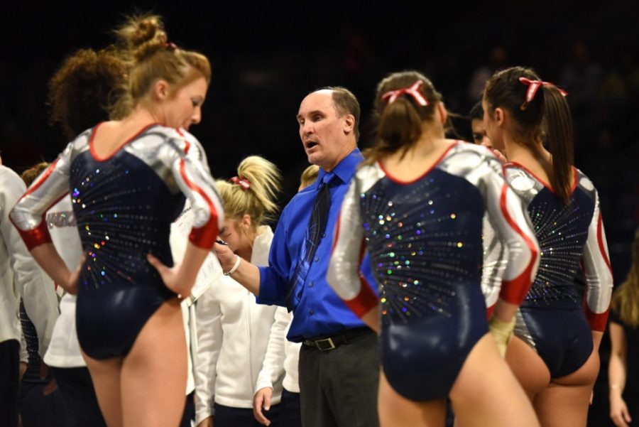 <p>Coach Bill Ryden speaks to his team during Arizona's 196.850-196.850 tie with Denver at McKale Center on March 14.</p>