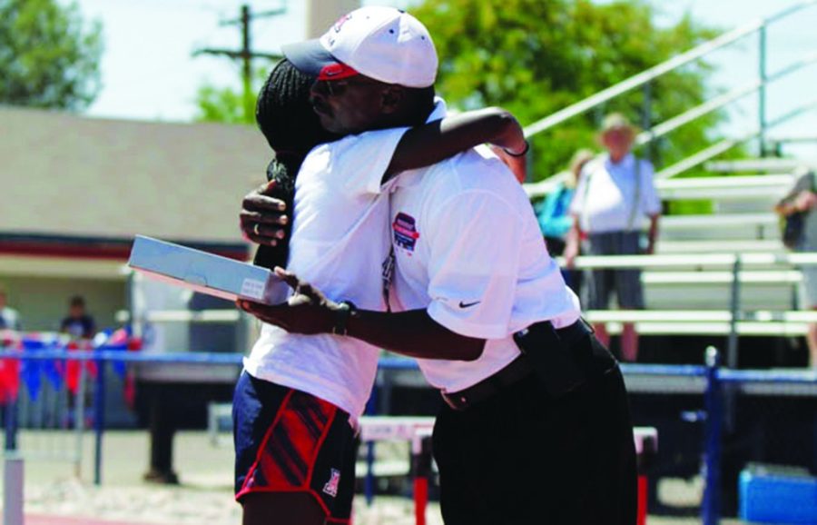 Arizona track and field distance runner Elvin Kibet hugs Arizona coach Fred Harvey during the Jim Click Shootout at Arizonas third place finish at Roy P. Drachman Stadium on April 11. Kibet and the Wildcats hit the road to participate in the Drake Relays on Friday.