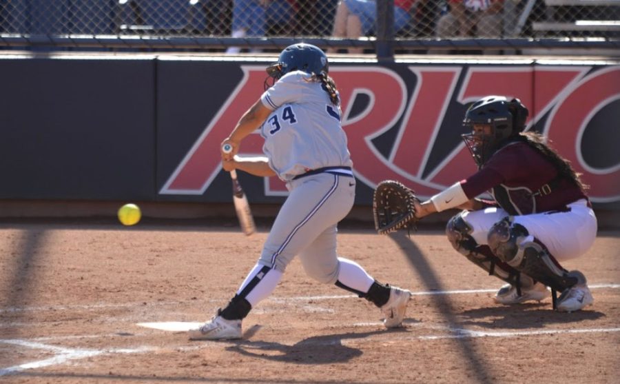 Arizona softball outfielder Katiyana Mauga (34) swings at a pitch during Arizonas 9-4 loss against ASU on Saturday at Hillenbrand Stadium. Mauga and the Wildcats hit the road to take on Oregon State on Thursday.