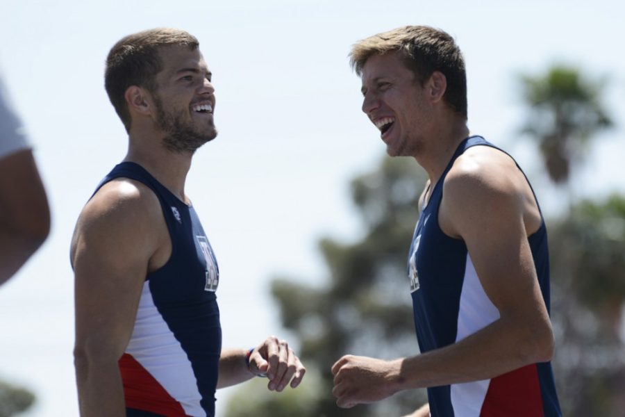 Arizona track athletes Harrison Ivie (left) and Pau Tonnesen (right) laugh together during the Jim Click Shootout Multis at Roy P. Drachman Stadium on April 10. The Wildcats head to the big apple to compete the weekend of Feb. 5.