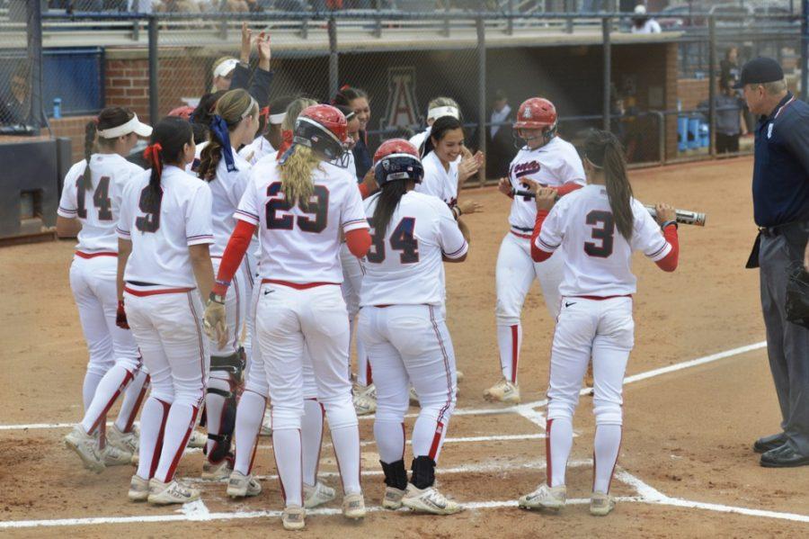 Arizona+softball+catcher+Chelsea+Goodacre+%2877%29+runs+home+to+be+greeted+by+shortstop+Kellie+Fox+%2829%29%2C+utility+Chelsea+Suitos+%283%29+and+other+teammates+during+Arizonas+22-5+win+against+Stanford+at+Hillenbrand+Stadium+on+April+26.+Goodacre%2C+Fox%2C+Suitos+and+Hallie+Wilson+will+play+in+the+last+home+series+of+their+careers+this+weekend.