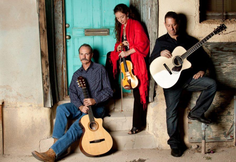 Courtesy of Southern Arizona Arts and Cultural AllianceGuitarist Mark Wilsey, left, poses next to violinist Beth Daunis, center, and guitarist Phil Lipman, right. Together the trio make up Reno del Mar. 