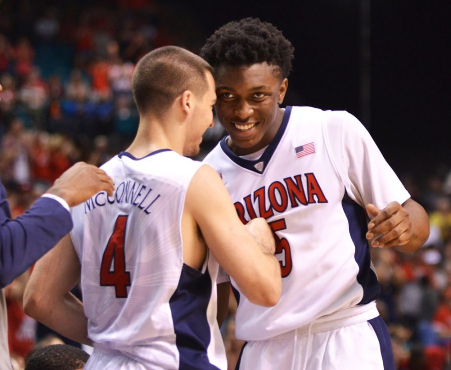Tyler Baker/Arizona Summer WildcatThen-Arizona forward Stanley Johnson (5) grins as he moves to embrace then-Arizona guard TJ McConnell (4) during Arizonas 80-52 win over Oregon in the Pac-12 Tournament at the MGM Grand Garden Arena in Las Vegas, Nev., on March 14. McConnell is playing for the Philadelphia 76ers alongside No. 3 overall draft pick Jahlil Okafor in the NBA Summer League. 