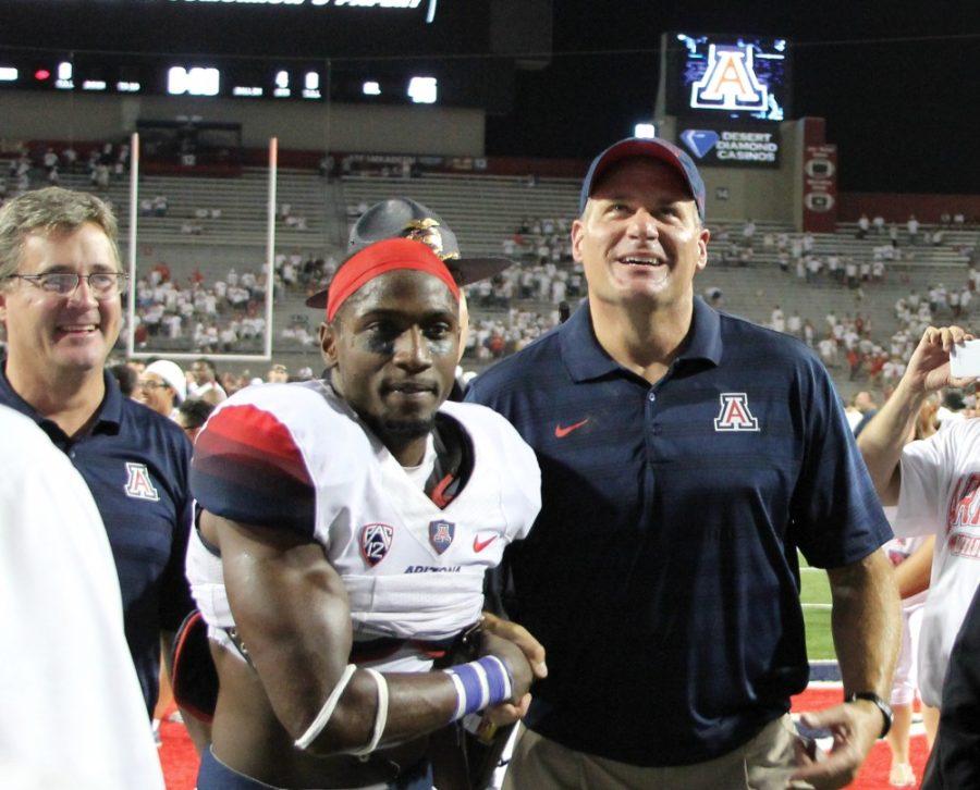Arizona+head+coach+Rich+Rodriguez+celebrates+after+their+49-45+win+over+Cal+on+Saturday%2C+Sept.+20%2C+2014.+The+game+was+a+white+out.
