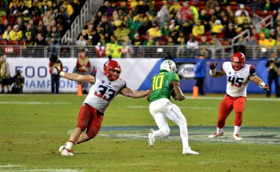 Arizona+linebacker+Scooby+Wright+III+reaches+for+a+tackle+while+playing+against+Oregon+in+the+Pac-12+Championship+on+Friday%2C+Dec.+5%2C+2014.
