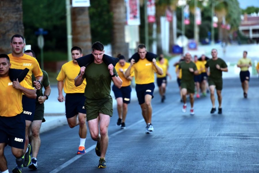 Navy and Marine ROTC students take turns carrying sandbags on their shoulders in a running drill during the 6 a.m. bi-weekly physical training session on the Mall on Monday, Sept. 28, 2015. Every Monday and Thursday morning the company does stretches and circuit workouts up and down the Mall from Old Main to Campbell Avenue for an hour.

Photo by: Rebecca Noble / The Daily Wildcat