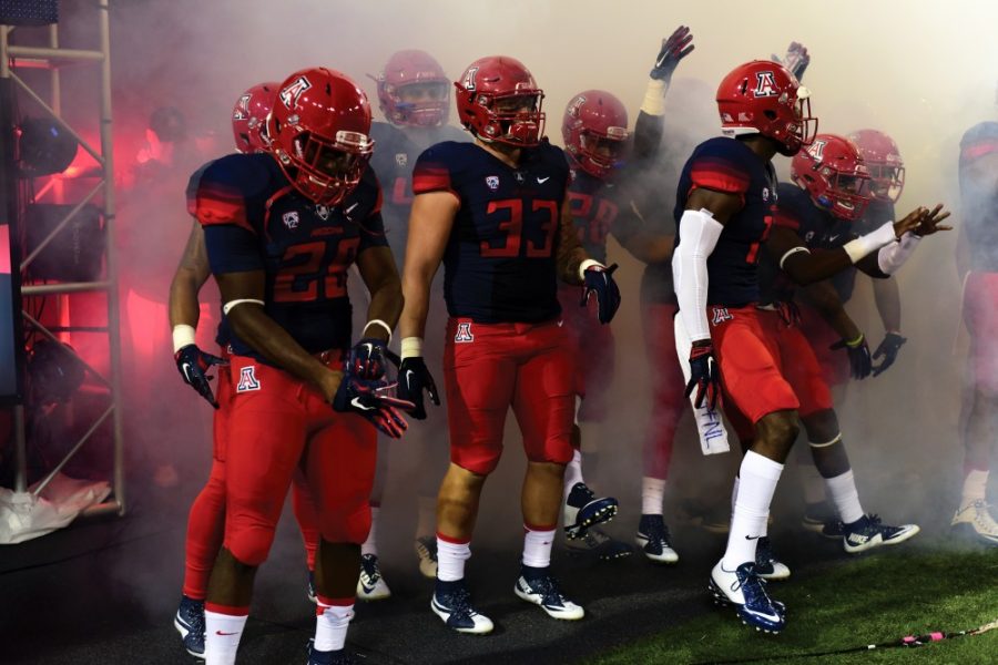 Arizona linebacker Scooby Wright (33) emerges from the locker room alongside his teammates during the Wildcats season opener against UTSA on Thursday, Sept. 3. Wright was injured in the first quarter of the game.