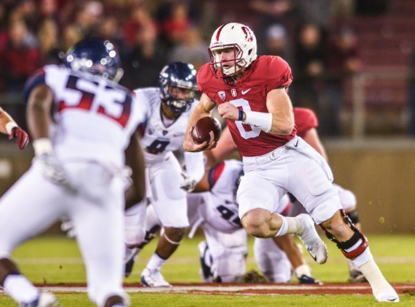 <p>Courtesy of Sam Girvin/The Stanford Daily</p><p>Stanford quarterback Kevin Hogan (8) runs the ball against Arizona during the Wildcats' loss Saturday, Oct. 3. The Wildcats are at a crosspaths in their season and must make adjustments.</p>