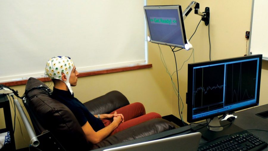 Courtesy of University of WashingtonUniversity of Washington graduate student Jose Ceballos wears an electroencephalography (EEG) cap. The cap is part of an experiment that records brain activity and sends a response to a second participant over the Internet.