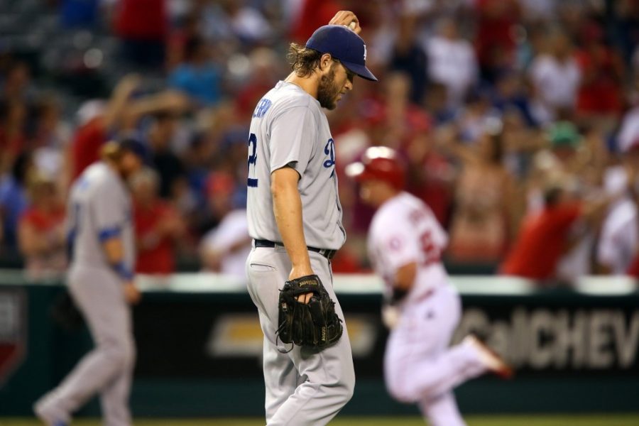 Los Angeles Dodgers pither Clayton Kershaw composes himself after surrendering a home run to the Los Angeles Angels' Kole Calhoun, background, in the first inning at Angel Stadium in Anaheim, Calif., on Tuesday, Sept. 8, 2015. (Robert Gauthier/Los Angeles Times/TNS)