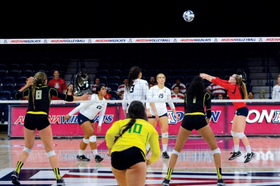 Arizona libero and defensive specialist Laura Larson (11) passes the ball to her teammates while playing against Oregon on Sunday, Sept. 27. Larson finished the game with 12 digs as Arizona knocked off Oregon in straight sets.