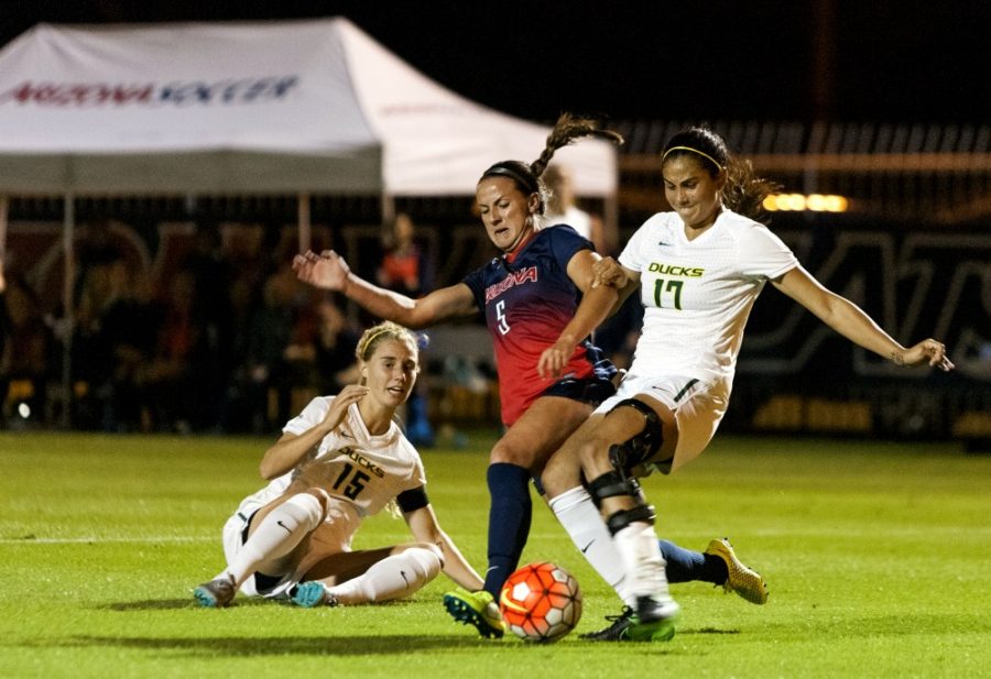 <p>Forward Kaitlyn Lopez defends the ball from Oregon players on Friday, Oct. 23. Arizona defeated Colorado 2-1.</p>