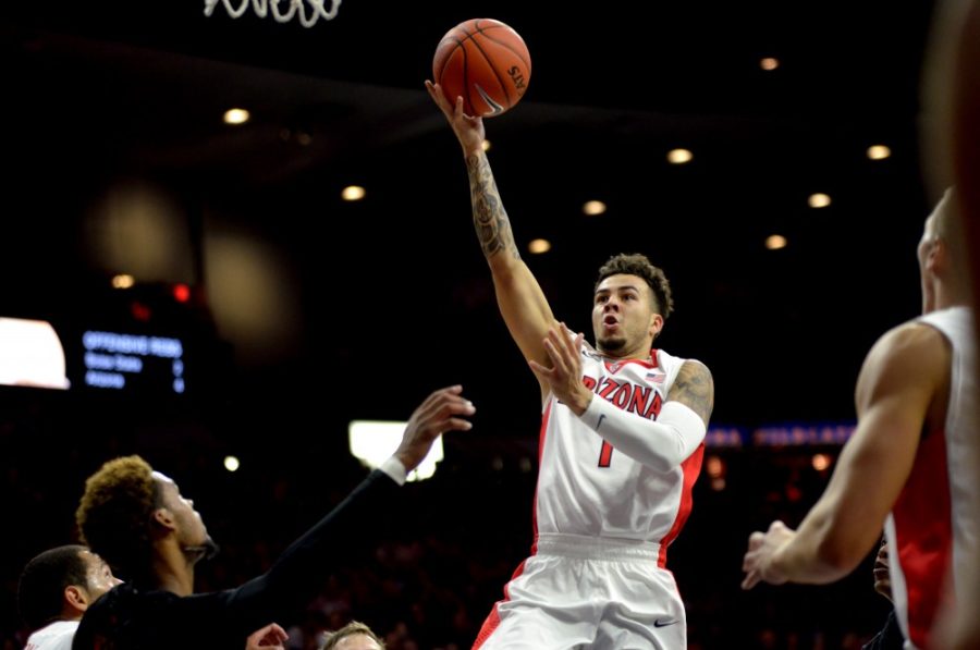 Arizona guard Gabe York (1) attempts a shot in the first half of the game against Boise State on Nov. 19. York led the Wildcats with 23 points.