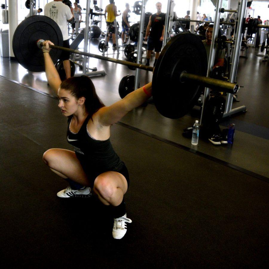 <p>Jordan Gunning, Nutrition Sophomore, lifts weights at the UofA Rec. Center on Monday, Oct. 12.</p>
