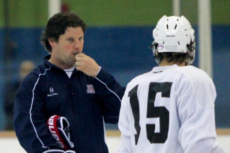 Arizona hockey head coach Chad Berman, left, blows a whistle at the 2014 Fans Practice on Oct. 23, 2014. Berman has the Wildcats out to a very similar start to the 2014 season, when Arizona finished the year 11-22-3.