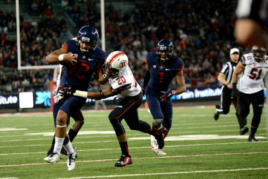 Arizona quarterback Anu Solomon (12) runs a play downfield in Arizona Stadium after failing to find an open reciever on Saturday, Nov. 14. Solomon was taken out of the game in the fourth quarter against then No. 10 Utah after suffering another head injury.
