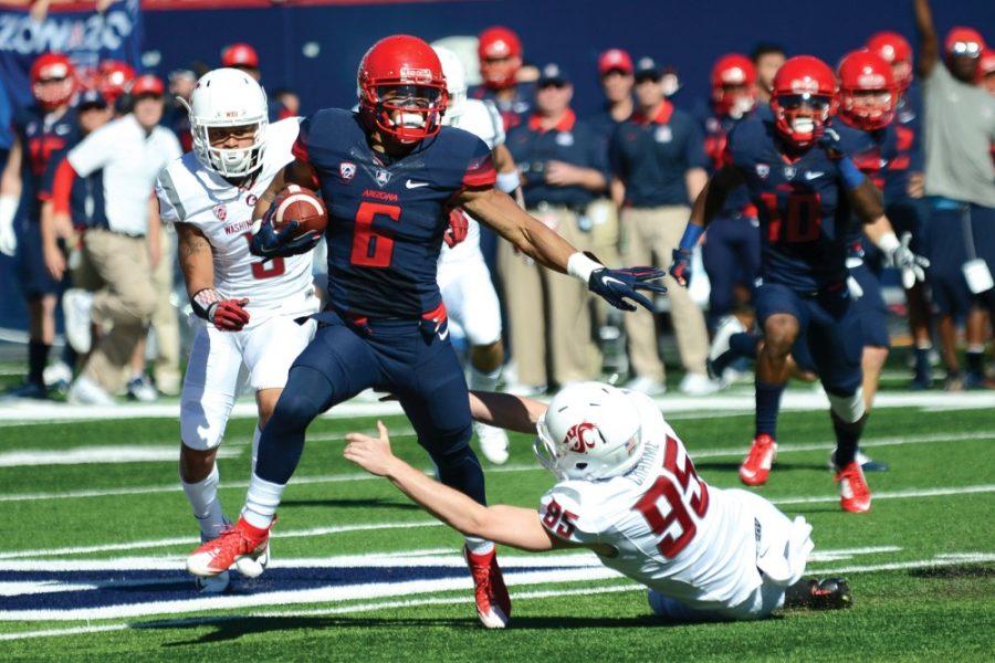 Arizona wide receiver Nate Phillips (6) dances around an attempted tackle by Washington State at Arizona Stadium on Oct. 24. Phillips and the Wildcats will need to prove they want victories if they wish to knock off a red-hot USC.