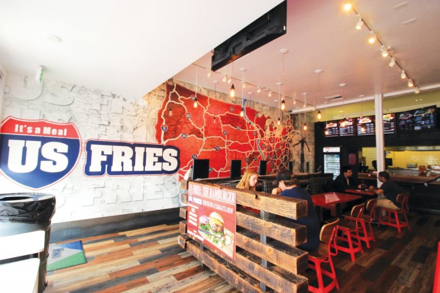 Customers dine at US Fries, located at 340 N. Fourth Ave. on Wednesday, Oct. 28. US Fries brings a traditional Canadian poutine and ecclectic variations of the dish to Tucson.