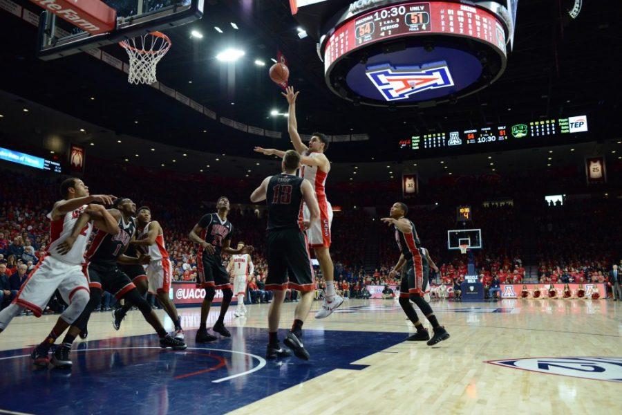 Arizona center Dusan Ristic shoots over UNLV forward Ben Carter. The Wildcats went onto defeat the Rebels 82-70 behind a career-high performance from Dusan Ristic. 