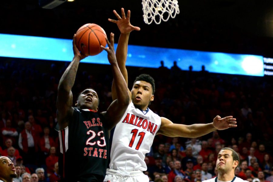 Arizona+guard+Allonzo+Trier+%2811%29+blocks+an+attempted+dunk+by+Fresno+State+guard+Marvelle+Harris+%2823%29+in+McKale+Center+on+Wednesday%2C+Dec.+9.+The+Wildcats+won+85-72.