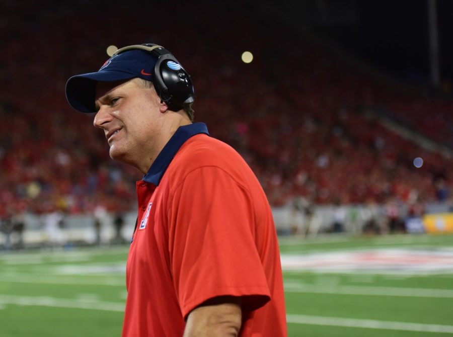 Arizona football head coach Rich Rodriguez smiles on the sidelines in Arizona Stadium on Sept. 26, 2015. Rodriguezs newly hired defensive staff of Donté Williams and Marcel Yates brings a recruiting edge to the Wildcats defense.