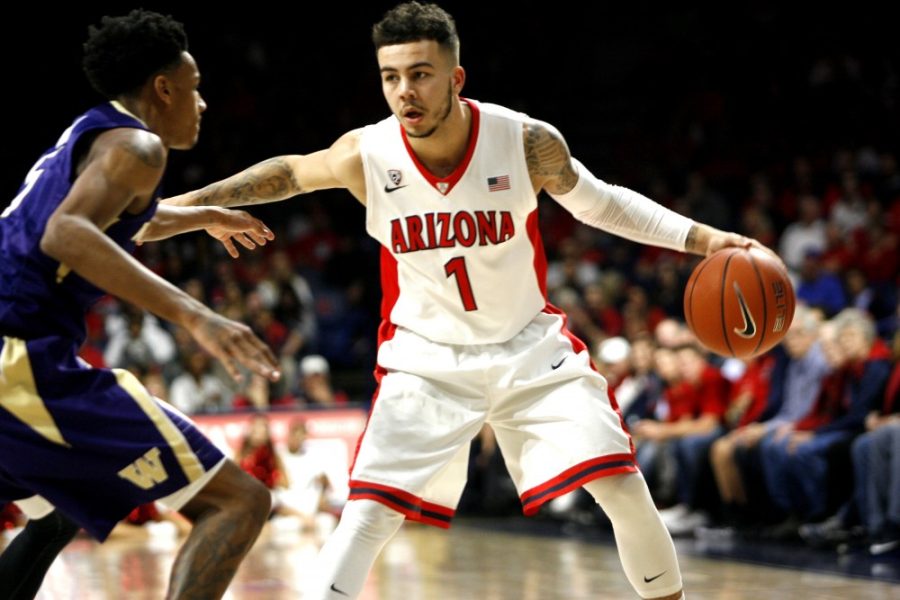 Arizona+guard+Gabe+York+%281%29+pushes+back+a+Washington+player+as+he+passes+to+a+teammate+in+McKale+Center+on+Thursday%2C+Jan.+14.+York+helped+fuel+the+Wildcats+offensive+attack+in+the+second+half+of+the+WIldcats+99-67+victory.