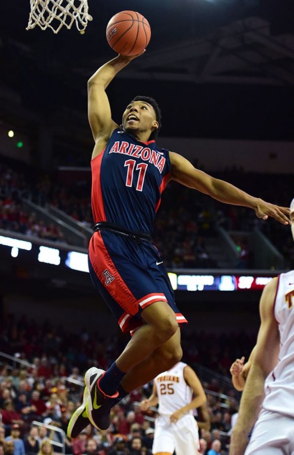 Arizona guard Allonzo Trier (11) jumps for a dunk at USC on Saturday, Jan. 9. 