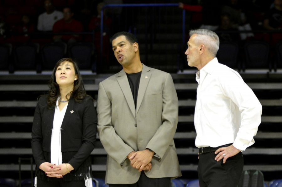 Arizona gymnastics head coach Tabitha Yim stands with assistant coaches John Court and David McCreary. Yim is in her first year as the Wildcats head coach and has brought a new sense of purpose to the gymnastics program.