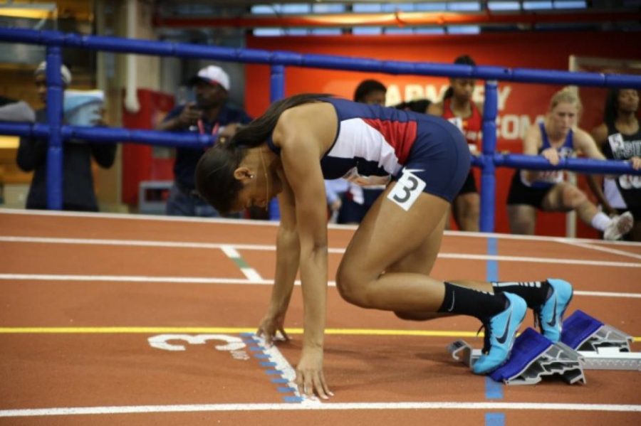 Arizona track and field athlete, Jasper Gray, readies hereself for a race in Birmingham, Alabama. Jasper and her relay squad placed seventh with a time of 3:38.09.