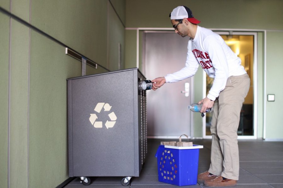 Yezan Hassan, a sophomore resident assistant at Arbol de la Vida, doing his part and recycling empty plastic bottles for Recycle Mania on Feb 13. In addition to the competition between Arizona and other colleges, Recycle Mania includes a contest between residence halls at the UA to see which hall will recycle the most.
