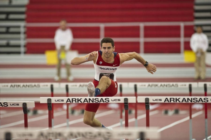 Former Arizona track and field athlete Lezo Urreliztieta jumps over a hurdle during a meet. In Dec 2013 Urreliztieta died from complications from a braing surgery.