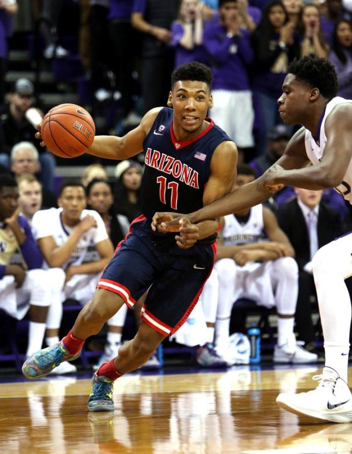 Arizona+Wildcats+guard+Allonzo+Trier+%2811%29+drives+on+Washington+Huskies+forward+Noah+Dickerson+%2815%29+during+the+first+half+of+the+No.+23+University+of+Arizona+Wildcats+vs.+University+of+Washington+Huskies+mens+college+basketball+game+at+Alaska+Airlines.