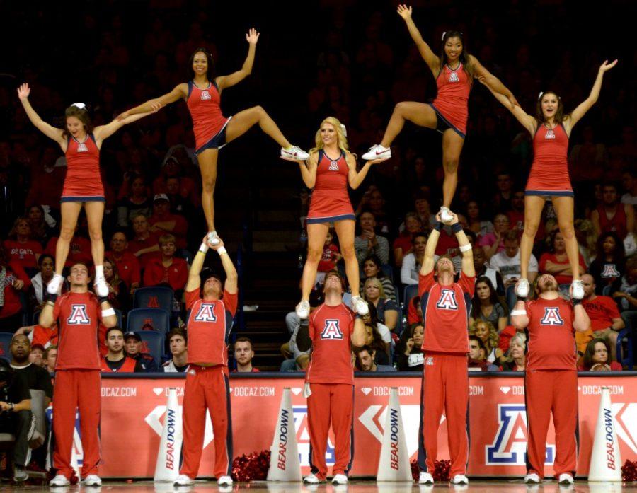 Arizona cheerleaders make a pyramid in McKale Center on Nov. 19, 2015. The Wildcats have inspired the Tucson community through their service with Special Olympics of Arizona and the Ronald McDonald House. 